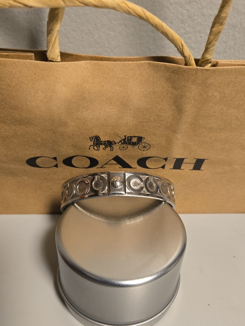 COACH Silver-Tone Signature C Engraved Bangle Bracelet